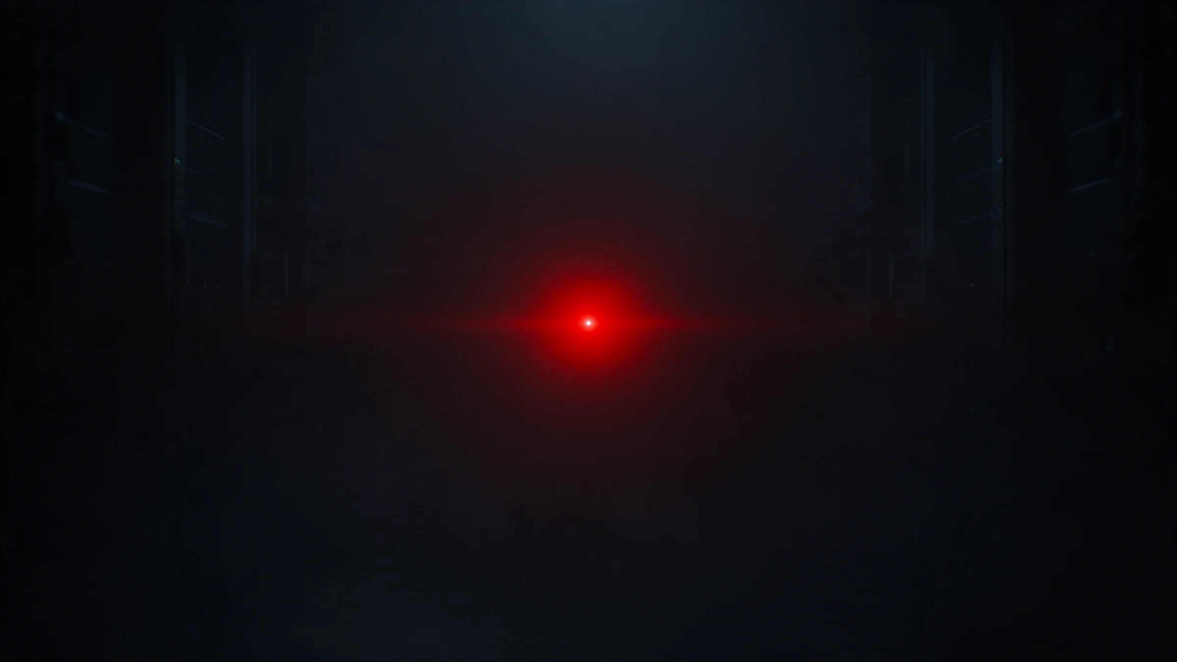 Un único punto de luz roja, estable, en un espacio oscuro y despejado